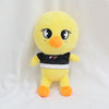 A yellow cartoon chick plush toy with black and white accents.