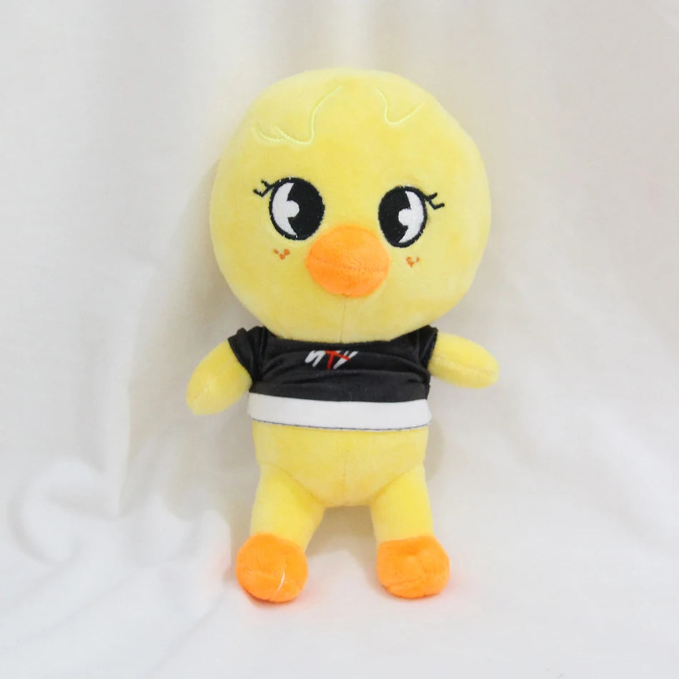 A yellow cartoon chick plush toy with black and white accents.