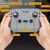 A hand holds an electronic control panel for an RC forklift truck, showing various controls like fine-tune buttons and power 