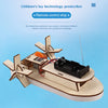 A wooden paddle boat model built from a kit, featuring a propeller and control mechanism.