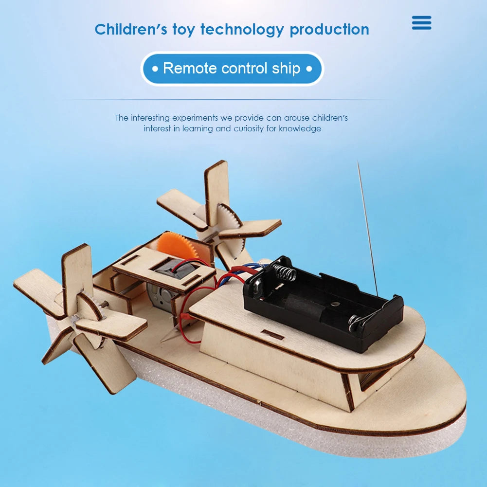 A wooden paddle boat model built from a kit, featuring a propeller and control mechanism.