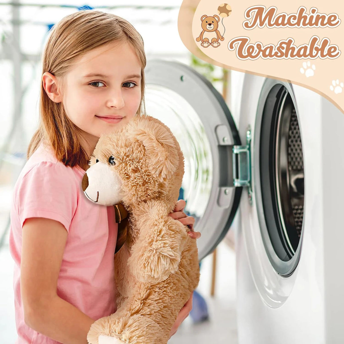 A girl holds a classic 14 inch plush teddy bear next to a washing machine, demonstrating the product's washable feature.