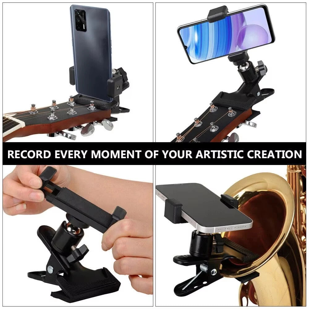 A black phone clip designed to attach to a guitar headstock for recording artistic creation.
