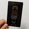 A black card featuring an arched rainbow design and text about micro-managing the universe with spells