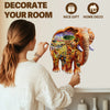 A woman is decorating a room with an elephant-themed wooden jigsaw puzzle for kids.