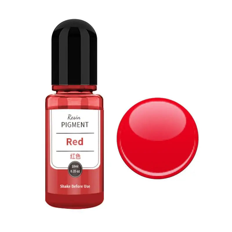 A small glass bottle of red resin pigment with a black cap next to a round red pigment disk.