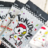 A close-up of a pack of Tokidoki Unicorn Adventure Journey Series Vol.1 collectible cards featuring a white unicorn design.