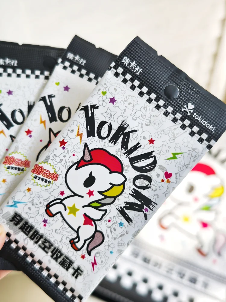 A close-up of a pack of Tokidoki Unicorn Adventure Journey Series Vol.1 collectible cards featuring a white unicorn design.