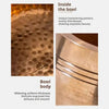 Close-up view of a wooden bowl showing unique hammering patterns and smooth finish.