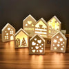 A set of decorative LED light-up silicone molds shaped like houses, hearts, and Christmas trees.