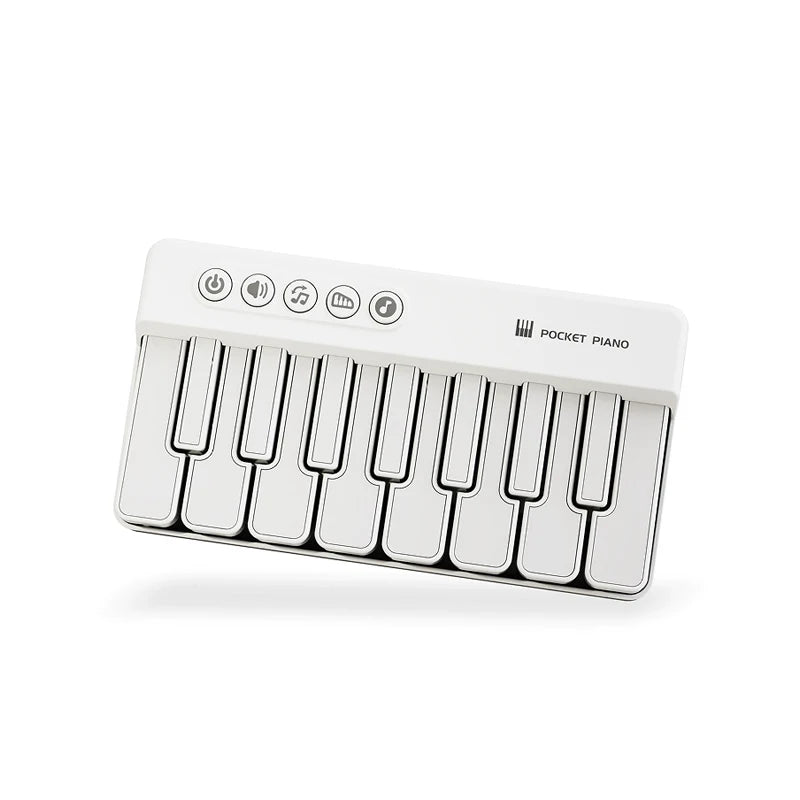 A white mini piano with 15 keys and various control buttons is shown.