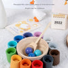 Montessori wooden color sorting game featuring rainbow balls and cups for children