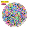 A pile of 5mm beads in various colors including pink, green, blue, and black, used for craft projects.