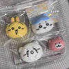 A collection of cute squishy toys featuring yellow, blue, and pink characters packaged in clear plastic.