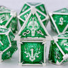 A set of seven green and silver metal dice, including a prominent house-shaped die.