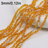 A close-up of strands of sparkling orange crystal triangle beads for jewelry making