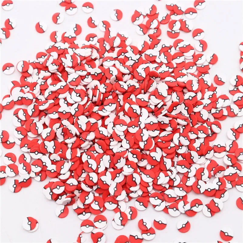 A pile of small red and white polymer clay flower charms for DIY crafts