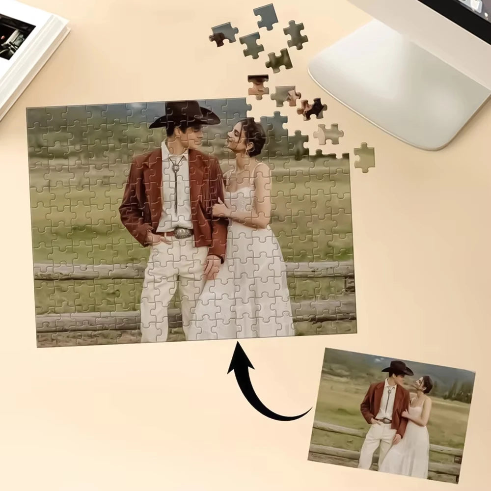 A photo of a couple is shown as a jigsaw puzzle, with pieces scattered above the image.
