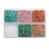 A clear plastic box filled with various colors of crushed glass stones for resin and craft projects.