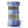 A set of six skeins of vibrant embroidery thread in various shades of blue and purple for cross stitch and DIY crafts