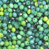 Multicolor round crystal glass beads in shades of green and blue for jewelry making