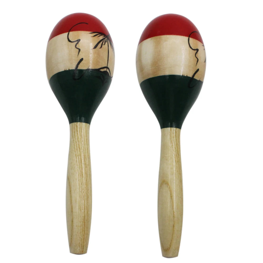 A pair of hand-painted wooden maracas with red and black painted tops and light wood handles.