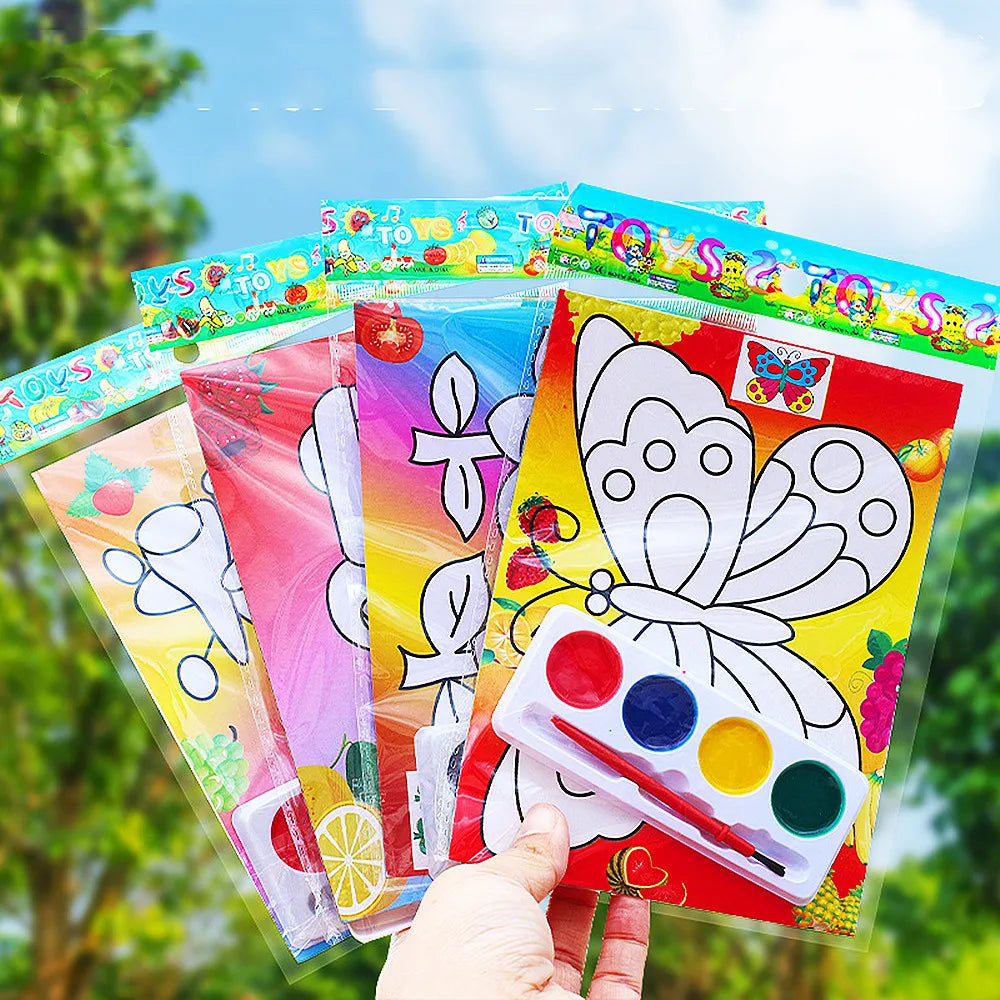 A collection of colorful DIY cartoon coloring painting kits for kids displayed outdoors.