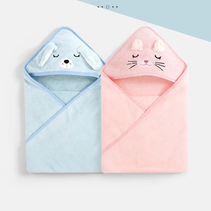 A pair of hooded animal bath towels, one blue dog and one pink cat, for babies and toddlers.
