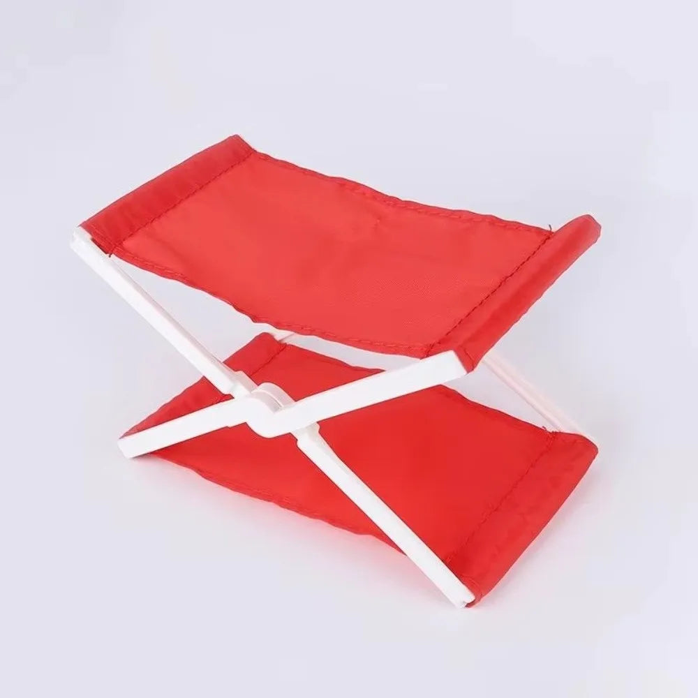 A red foldable camp pillow with white straps is shown open and closed.