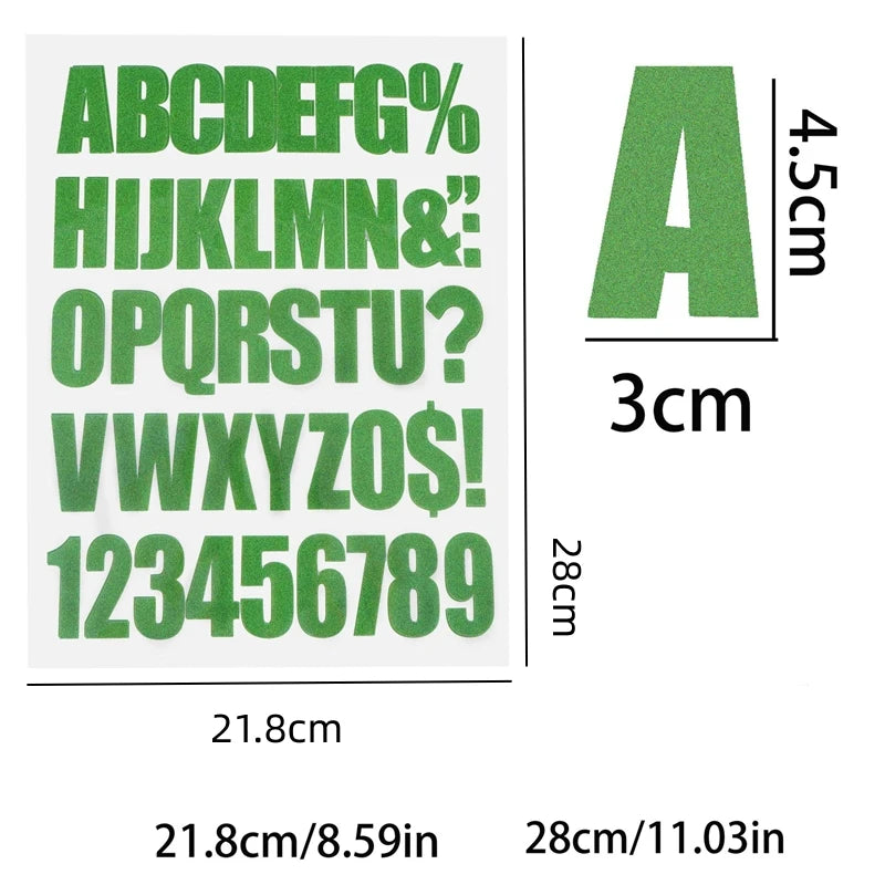 A sheet of green DIY iron-on heat transfer patches showing the alphabet and numbers.