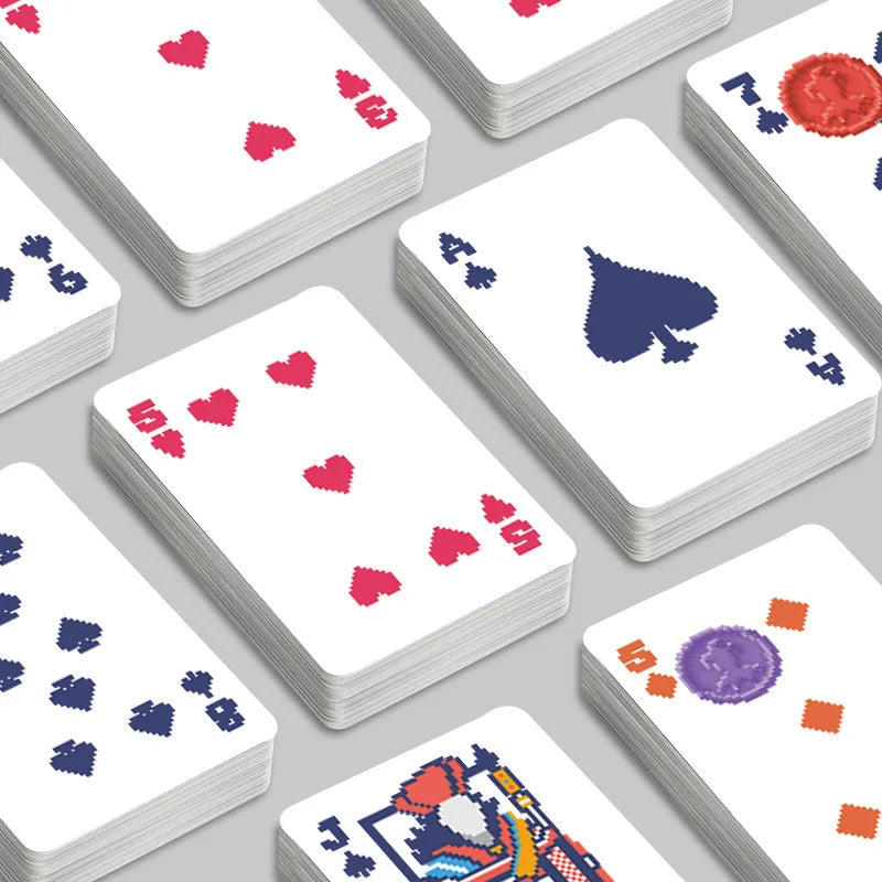 A close-up view of a classic joker poker playing card deck featuring various colored cards and symbols.