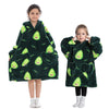 A young girl models a dark green fuzzy hoodie sweater with a green leaf pattern.