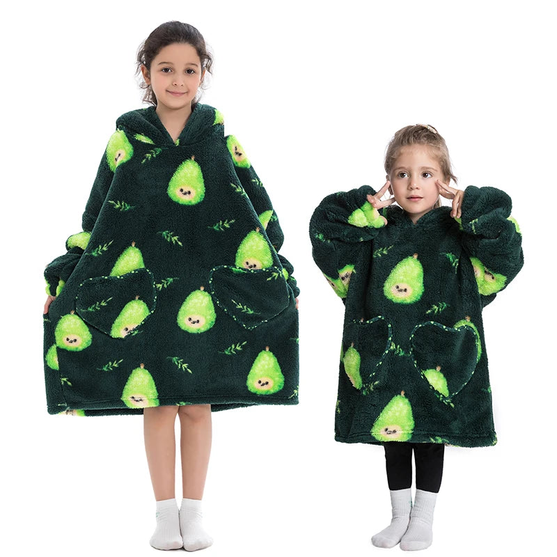 A young girl models a dark green fuzzy hoodie sweater with a green leaf pattern.