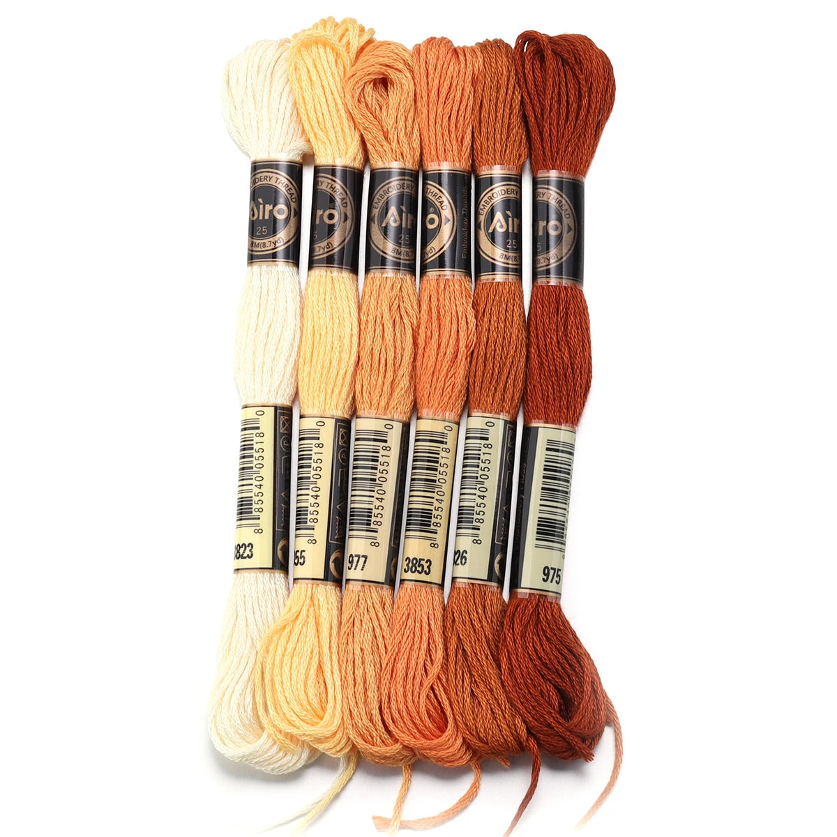 A set of six skeins of vibrant embroidery thread in various shades of orange and cream for cross stitch and DIY crafts