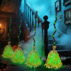 Animated witch broom with sound and green LED glow resting on a dark wooden surface.