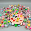 A large collection of transparent plastic eggshell party favors in various bright colors and patterns.