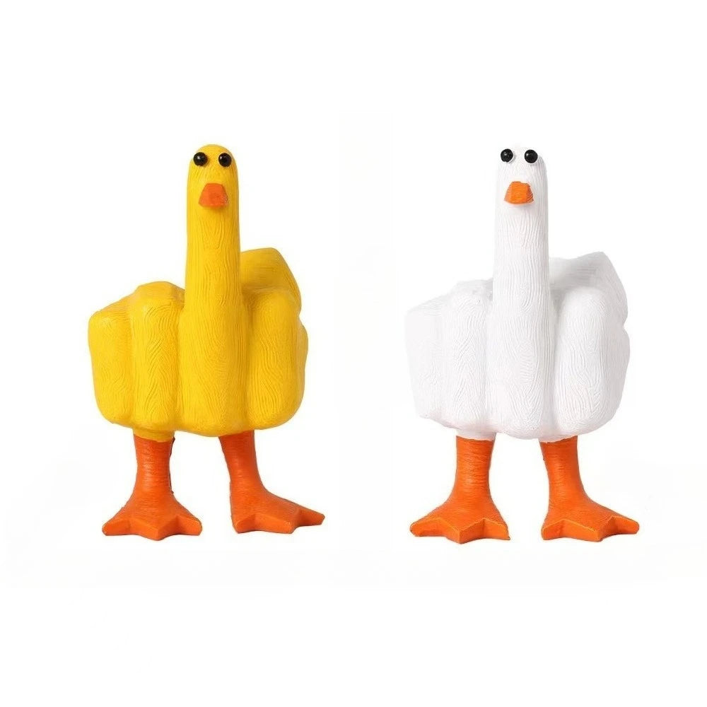 A resin figurine of a goose with a funny middle finger gesture, colored yellow and white.