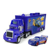 A blue diecast toy hauler truck with a large purple trailer and a smaller blue pickup truck.