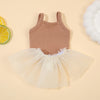 A beige ribbed top and sheer tulle skirt set for a baby doll outfit.