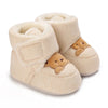 Pair of beige baby winter cartoon boots with fuzzy lining and soft non-slip soles