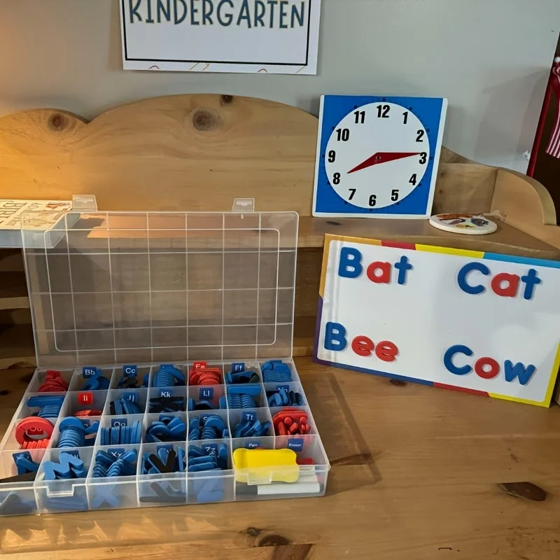 A clear plastic box contains a set of colored magnetic letters for educational learning.