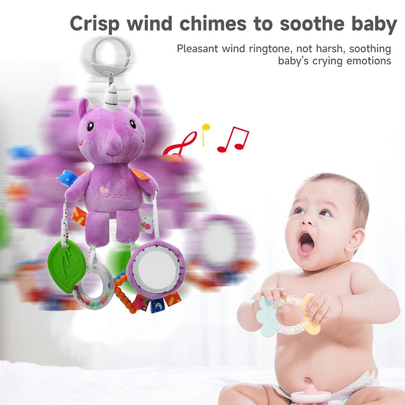 A purple plush unicorn hanging rattle toy is shown next to a baby, illustrating a crisp wind chime for soothing baby's crying