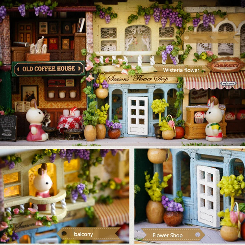 A detailed wooden miniature dollhouse theater kit featuring a storefront with flowers and a balcony.