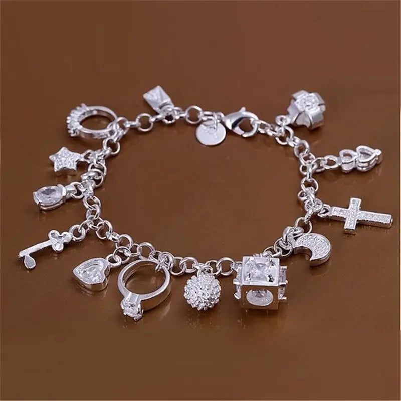 Silver Tone Crystal Charm Bracelet with Thirteen Pendants