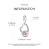 A silver heart charm for bracelets and necklaces with a pink accent.