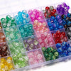 A clear plastic box filled with various colors of 8mm glass crackle beads for jewelry making