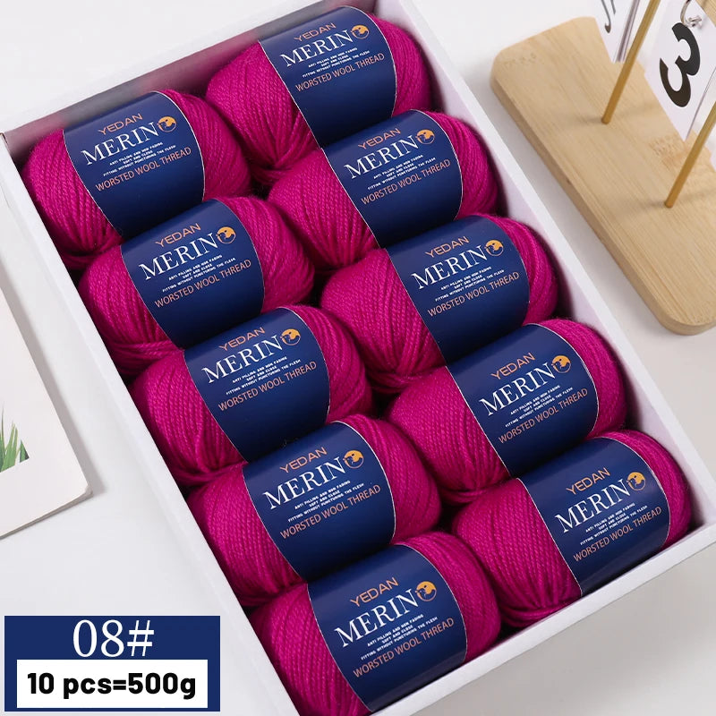 A box of 10 skeins of YEDAN MERIN wool thread in magenta color for knitting projects