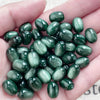 A handful of ten polished green and gold resin starry sky cat's eye beads for jewelry making