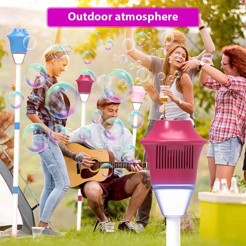 A group of people enjoying an outdoor atmosphere with a pink bubble machine and lights.
