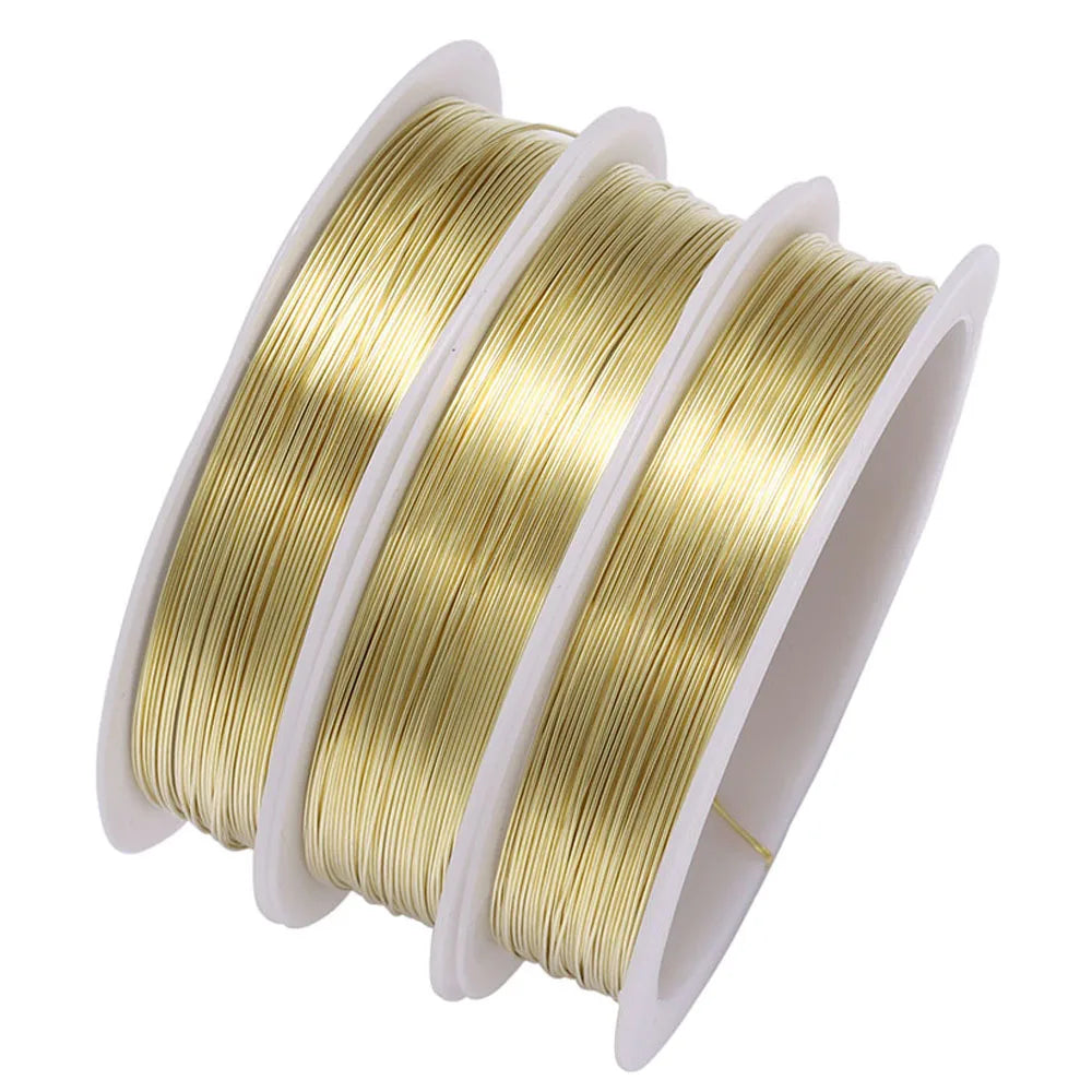 Spool of gold-colored copper beading wire for jewelry making